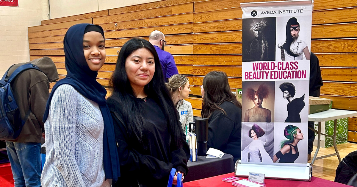 two female students smiling at camera